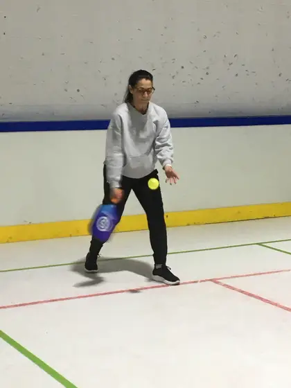 A player returning a pickleball