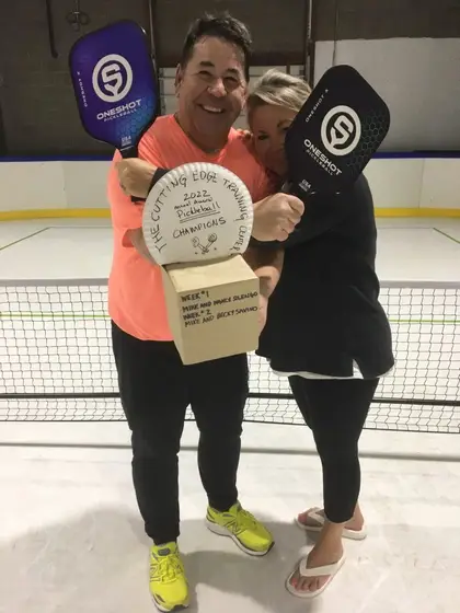 The week two champions hugging with the trophy